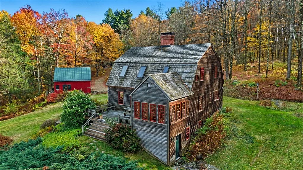 Main house and red barn in full autumn color