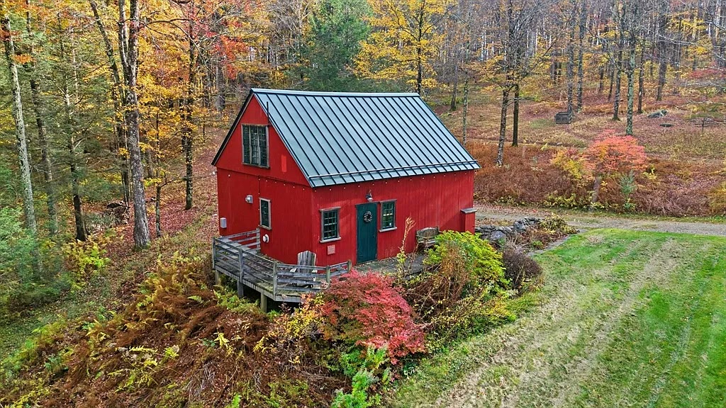 The red barn in vibrant fall foliage